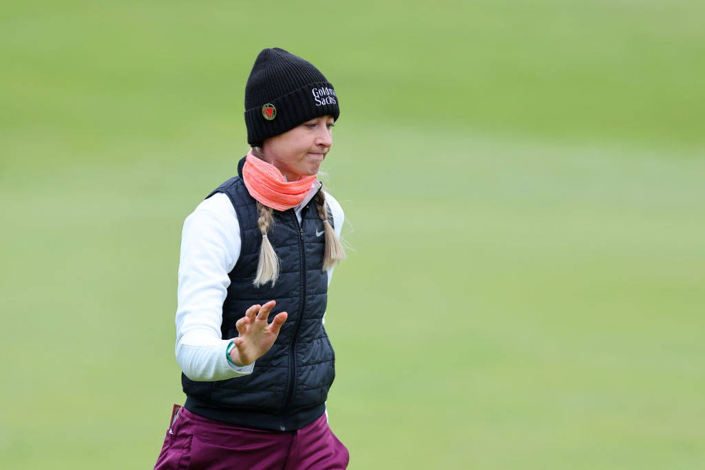 Nelly Korda of the United States acknowledges the crowd following putt on the 18th green during Day One of the AIG Women's Open